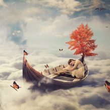 woman sleeping on boat in clouds