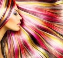 profile of woman with brightly colored hair fanned around her