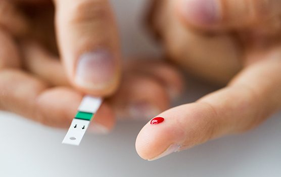 Finger pricked for type 2 diabetes blood sugar test
