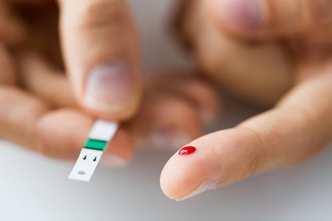 Finger pricked for type 2 diabetes blood sugar test
