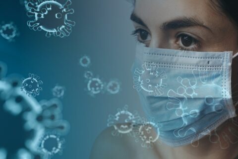 Graphic of woman wearing mask surrounded by atoms