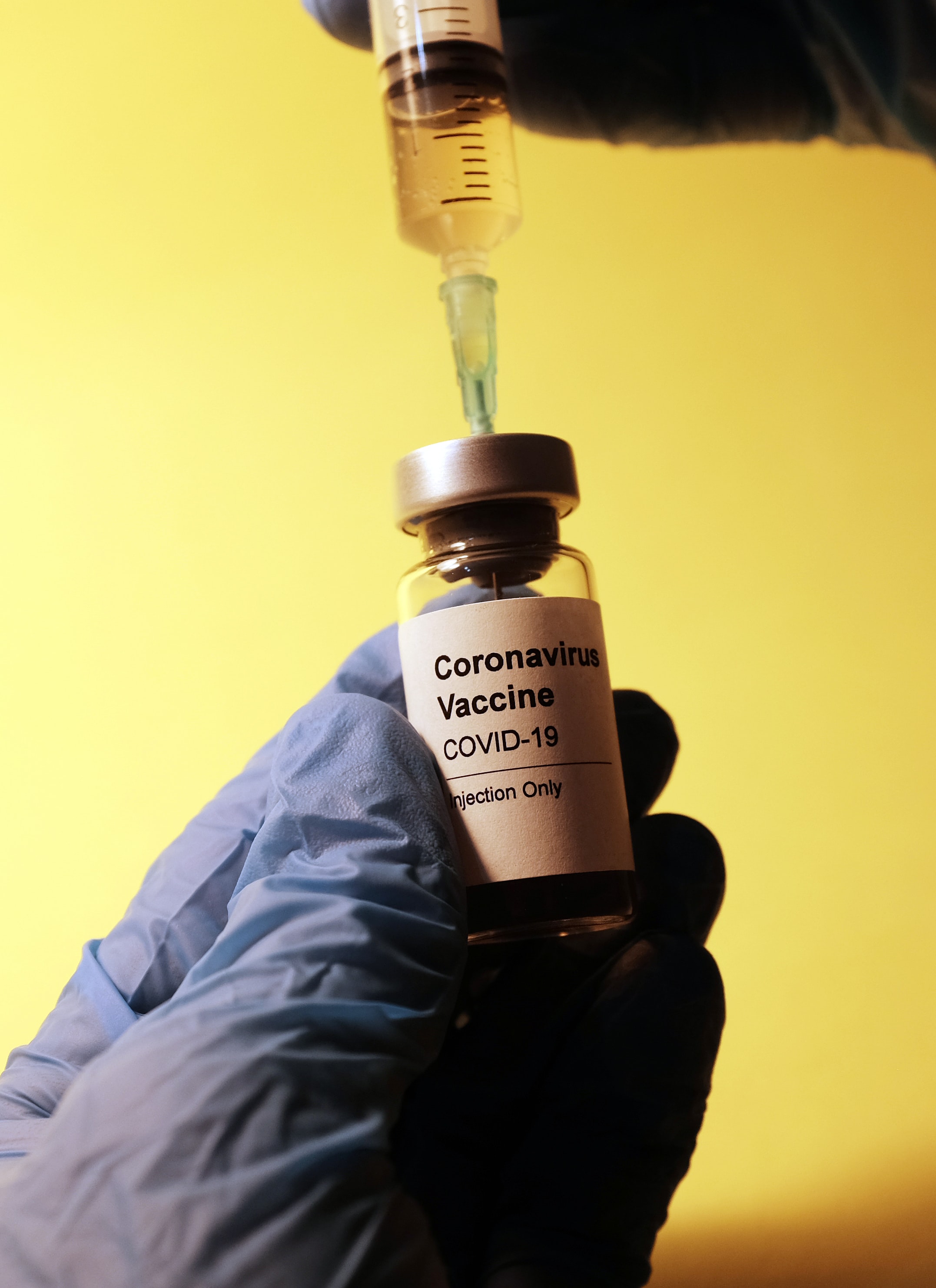 covid-19 vaccine in doctor's hand